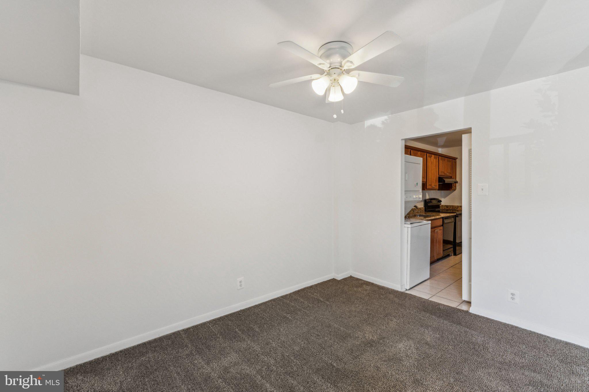 12001 Old Columbia Pike, Unit 209 Silver Spring, MD 20904 - Photo 4 of 27 a view of empty room with window