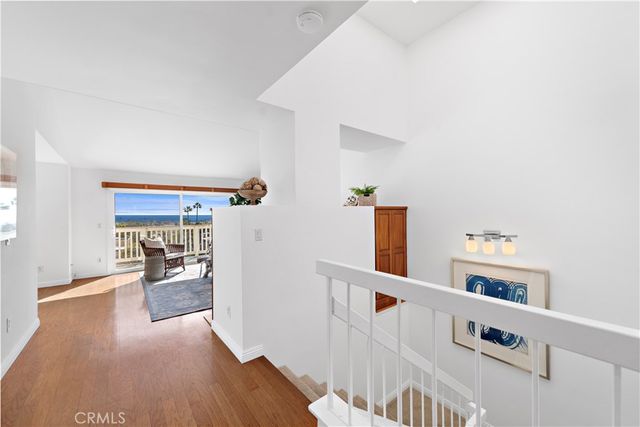 a view of a hallway with seating space