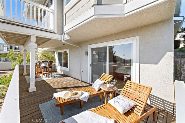 a living room with furniture wooden floor and a table