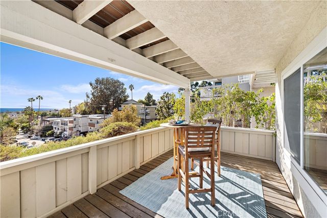 a view of a balcony with wooden floor