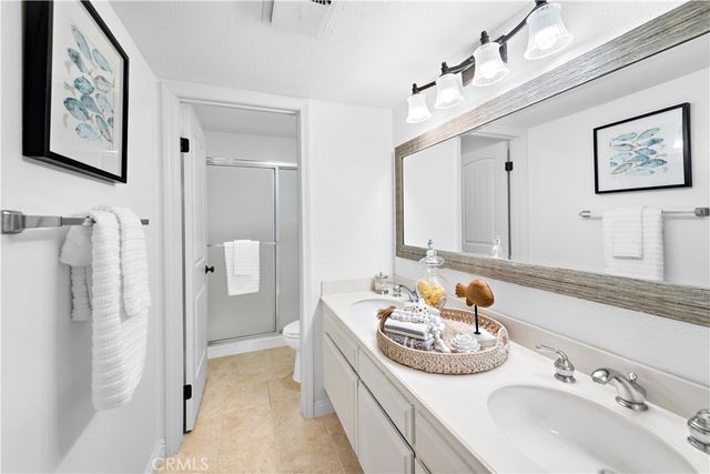 a bathroom with a sink double vanity and a mirror