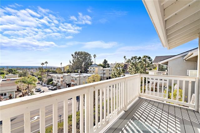 a view of a balcony with city view