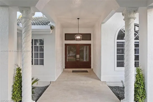 a view of a hallway with entryway windows and entryway