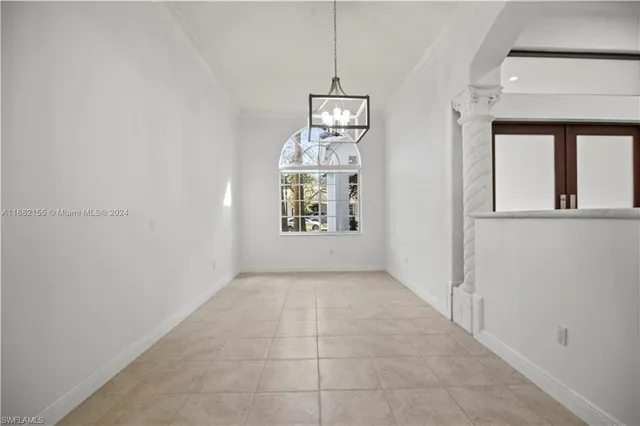 a view of a hallway with windows
