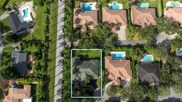 an aerial view of house with yard