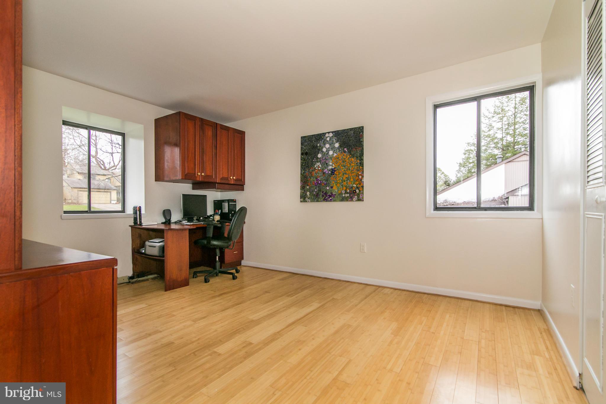 11821 Blue Spruce Road Reston, VA 20191 - Photo 17 of 28 a view of workspace with wooden floor and windows