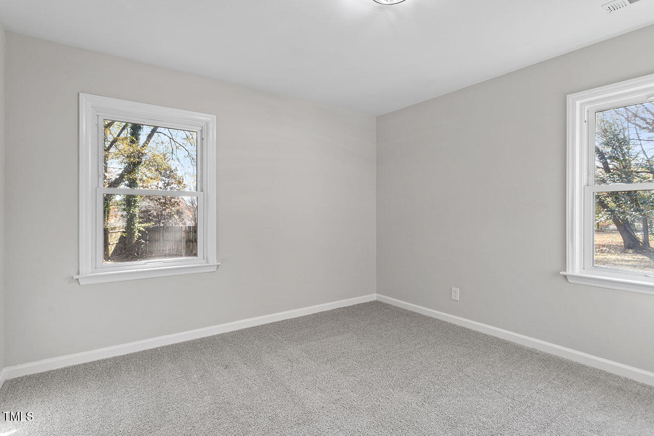 1014 Southerlund Road Garner, NC 27529 - Photo 23 of 36 an empty room with a window