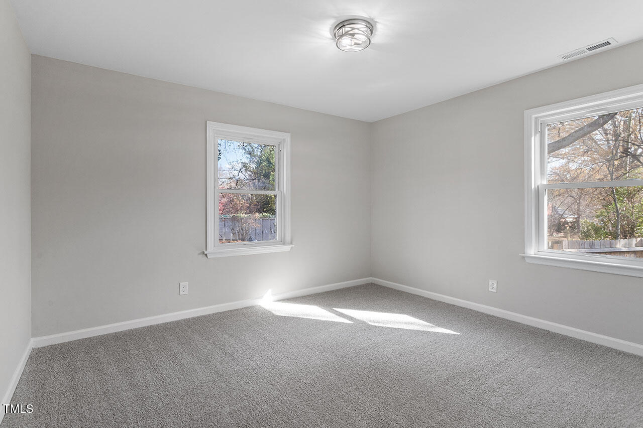 1014 Southerlund Road Garner, NC 27529 - Photo 24 of 36 an empty room with windows