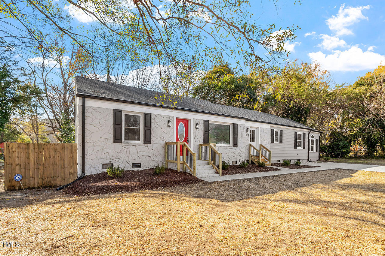 1014 Southerlund Road Garner, NC 27529 - Photo 29 of 36 a front view of a house with a yard