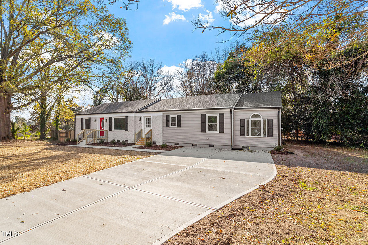1014 Southerlund Road Garner, NC 27529 - Photo 31 of 36 a front view of a house with a yard