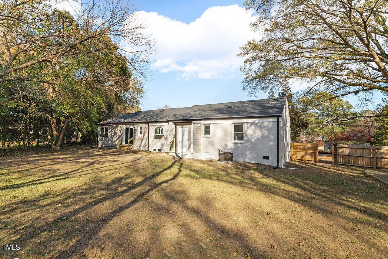 1014 Southerlund Road Garner, NC 27529 - Photo 34 of 36 a front view of a house with a yard