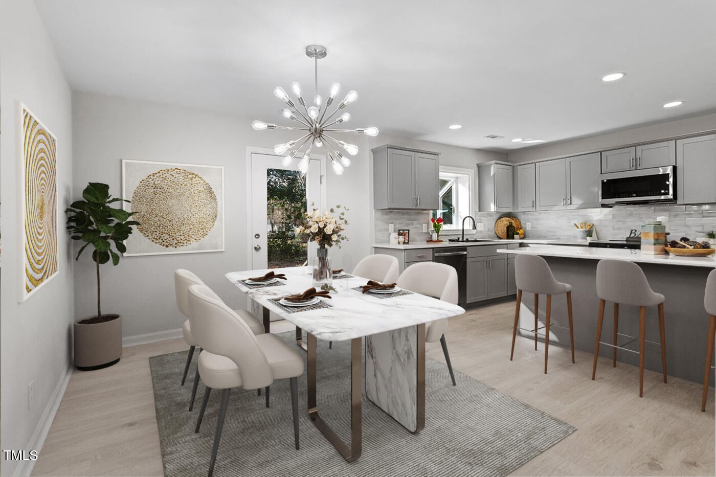 1014 Southerlund Road Garner, NC 27529 - Photo 4 of 36 a kitchen with a dining table chairs and refrigerator