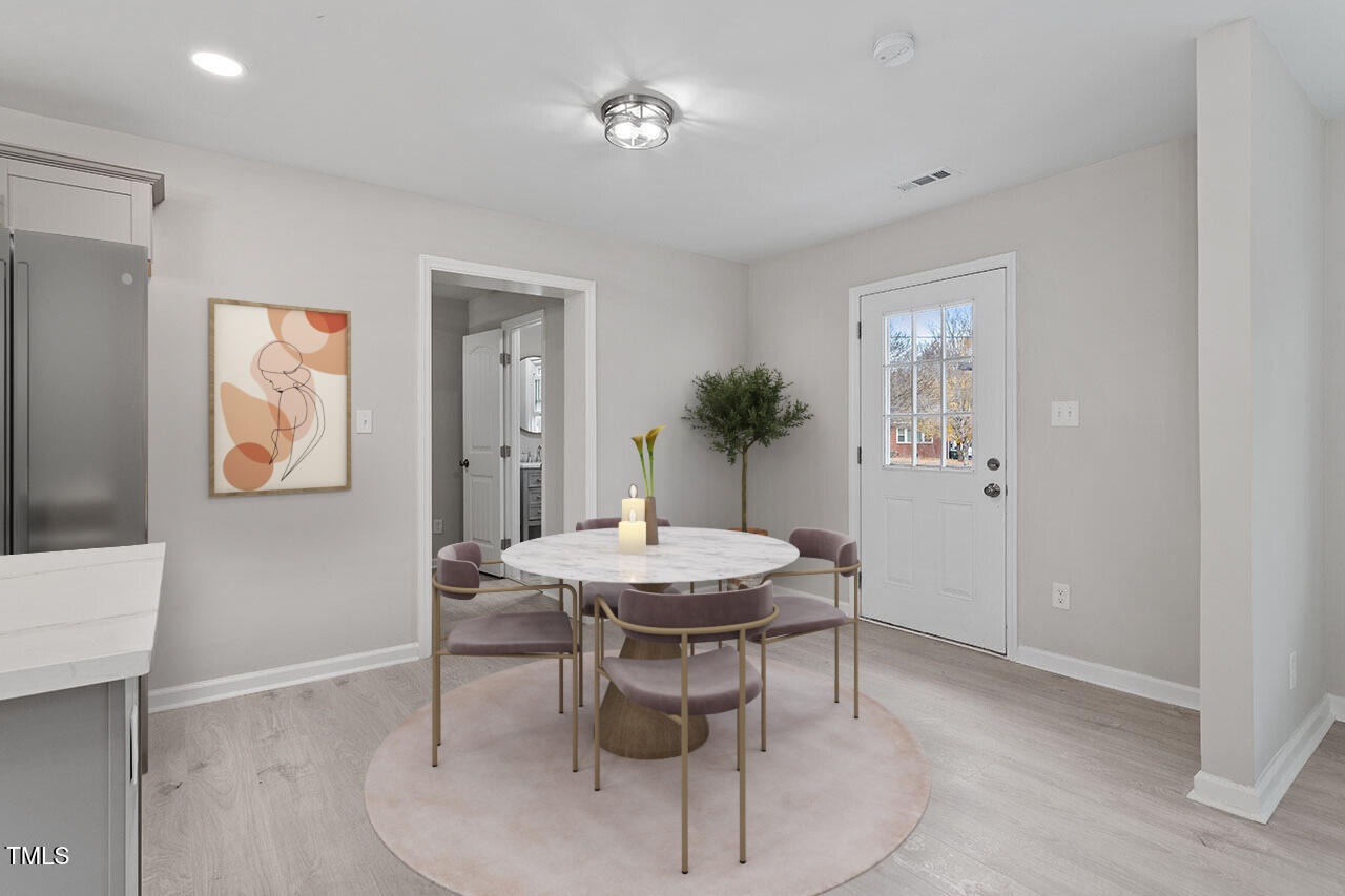 1014 Southerlund Road Garner, NC 27529 - Photo 6 of 36 a view of a dining room with furniture