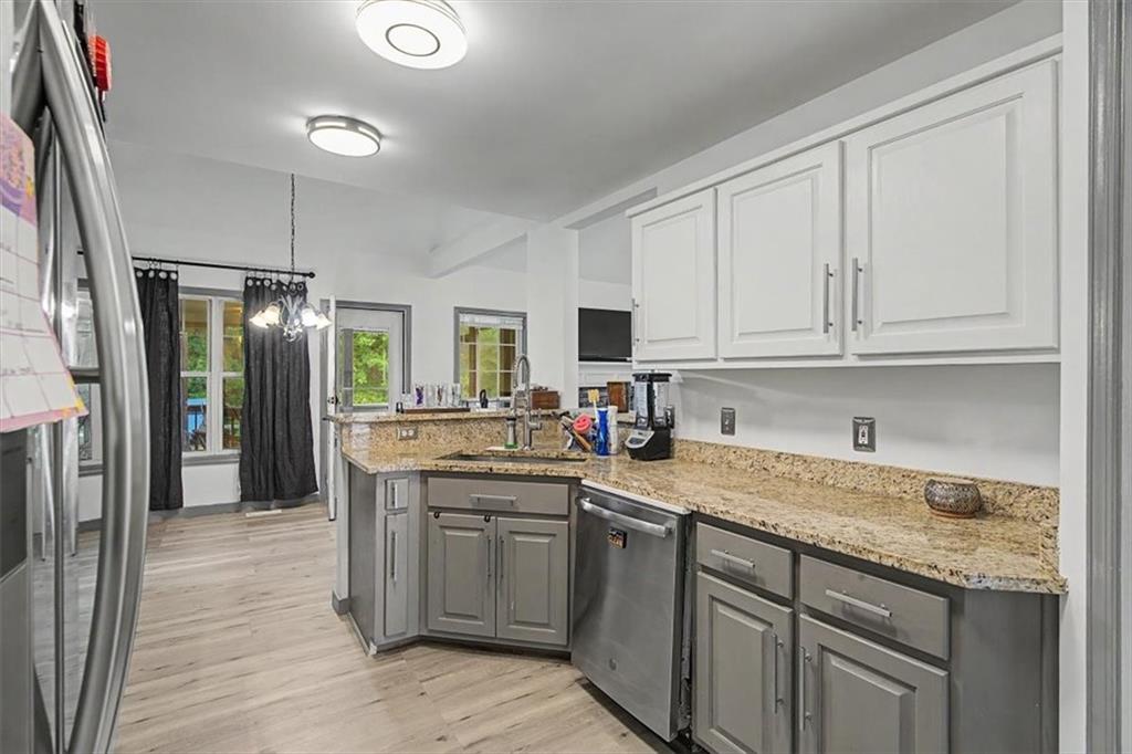 409 Windsor Way Canton, GA 30115 - Photo 9 of 51 a kitchen with a sink stove and refrigerator