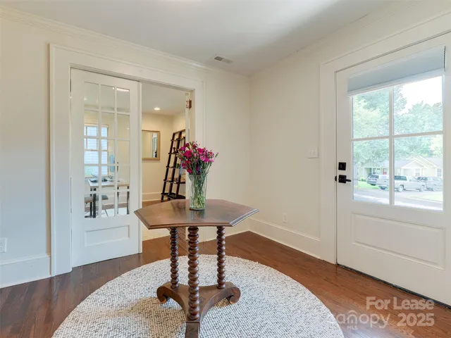 a room with furniture and wooden floor