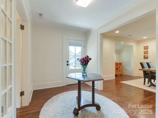 a view of a livingroom with furniture and a potted plant