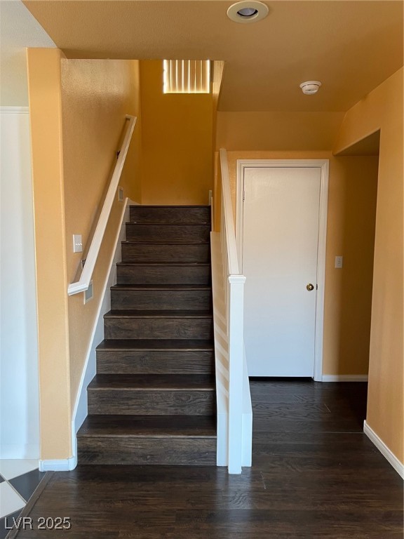 212 Silver Castle Street Las Vegas, NV 89144 - Photo 12 of 24 Staircase with visible vents, baseboards, and wood finished floors