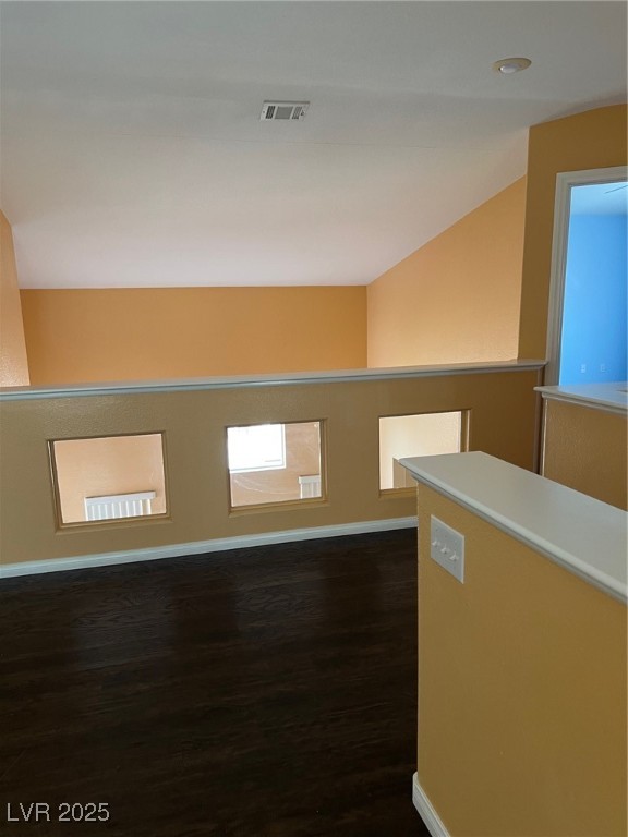 212 Silver Castle Street Las Vegas, NV 89144 - Photo 15 of 24 Spare room featuring visible vents, dark wood-style floors, and baseboards