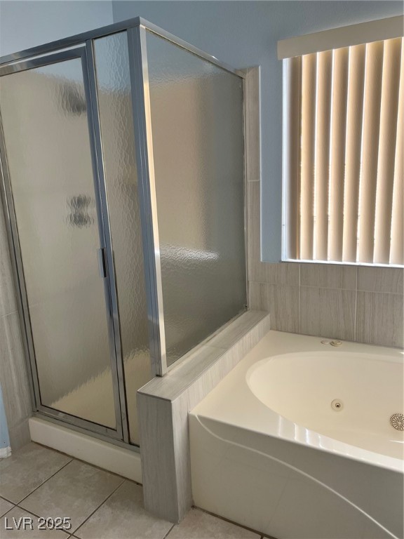 212 Silver Castle Street Las Vegas, NV 89144 - Photo 18 of 24 Bathroom featuring tile patterned flooring, a stall shower, and a garden tub