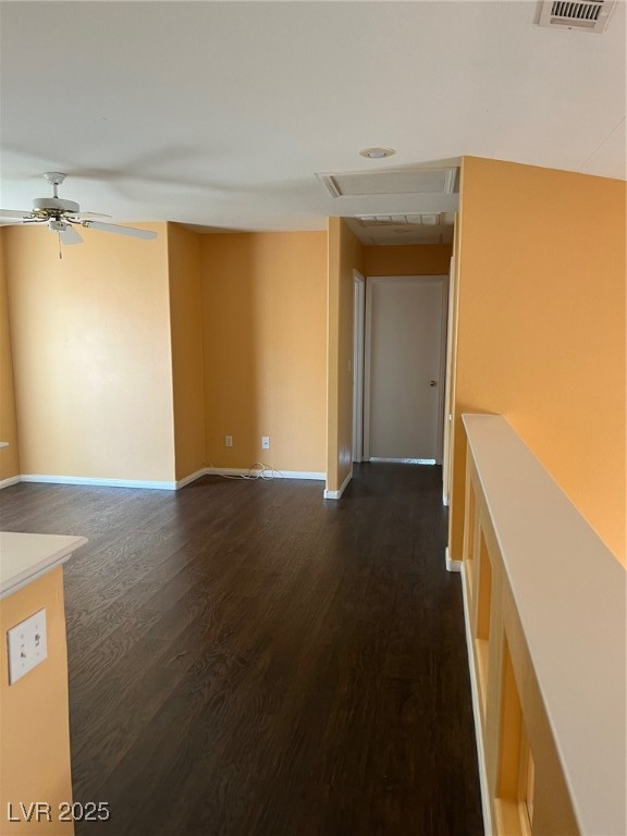 212 Silver Castle Street Las Vegas, NV 89144 - Photo 20 of 24 Empty room featuring ceiling fan, baseboards, attic access, and dark wood-style floors