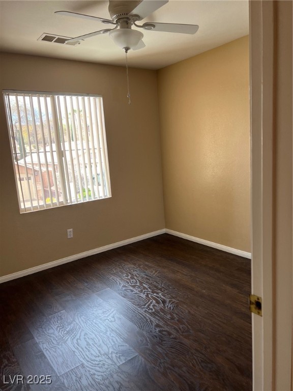 212 Silver Castle Street Las Vegas, NV 89144 - Photo 24 of 24 Unfurnished room with wood finished floors, visible vents, plenty of natural light, and ceiling fan