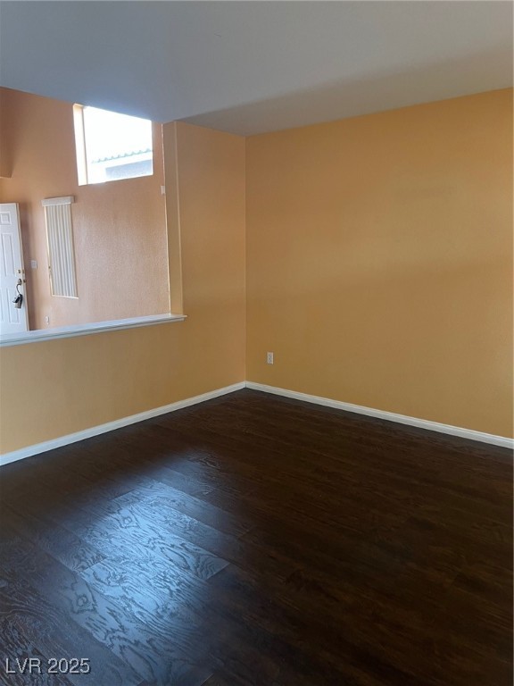 212 Silver Castle Street Las Vegas, NV 89144 - Photo 10 of 24 Unfurnished room with wood finished floors and baseboards