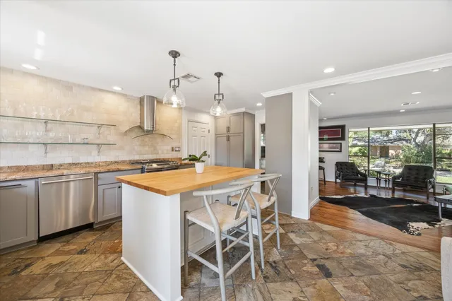 a living room with furniture and kitchen view