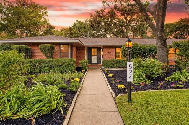a view of house with a garden