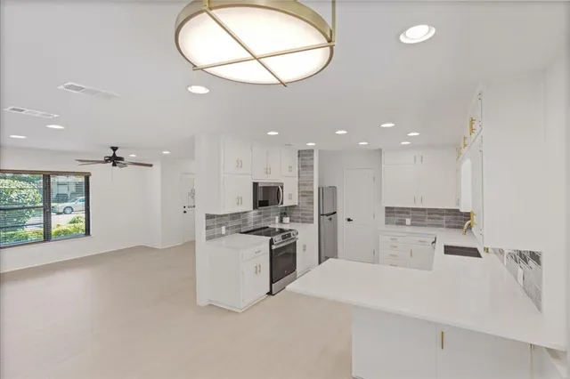 a view of a park with large trees