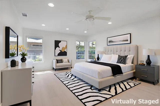 a kitchen with sink cabinets and wooden floor