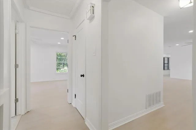 a spacious bedroom with a large bed and a view of bedroom