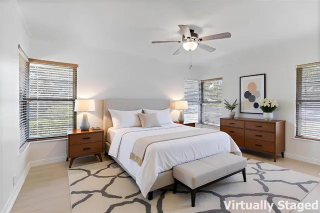 a bathroom with a sink a vanity and a large mirror