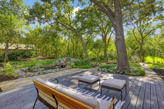 a spacious bedroom with a large bed and a large window