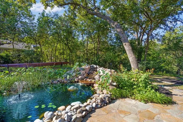 a bathroom with a sink a shower and a mirror