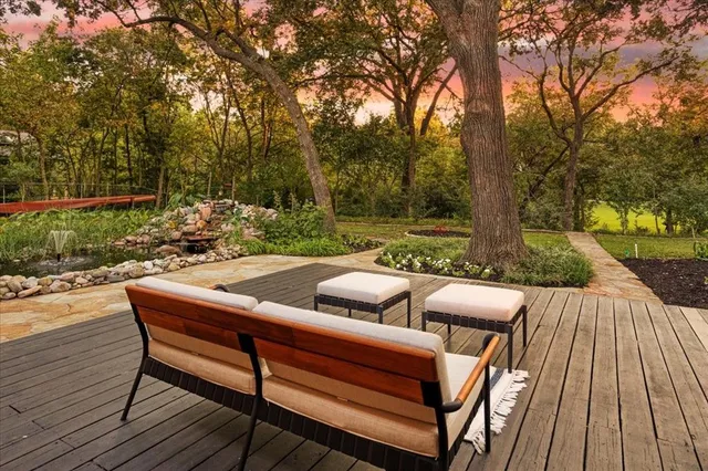 a backyard of a house with yard and outdoor seating