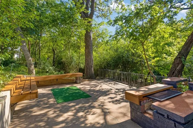 a view of a park with large trees