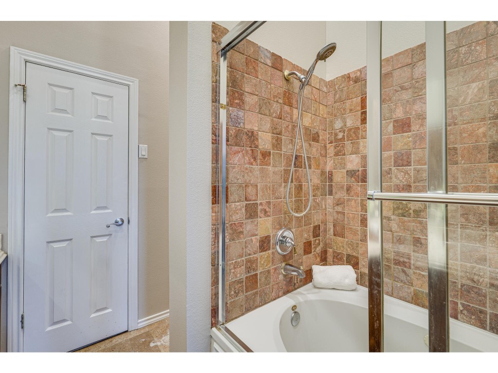 2918 Ranch Road 620 North, Unit U254 Austin, TX 78734 - Photo 17 of 35 a bathroom with a shower