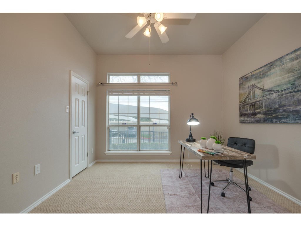 2918 Ranch Road 620 North, Unit U254 Austin, TX 78734 - Photo 23 of 35 a living room with furniture and a window