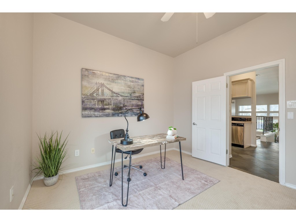 2918 Ranch Road 620 North, Unit U254 Austin, TX 78734 - Photo 24 of 35 a living room with furniture and a painting on the wall