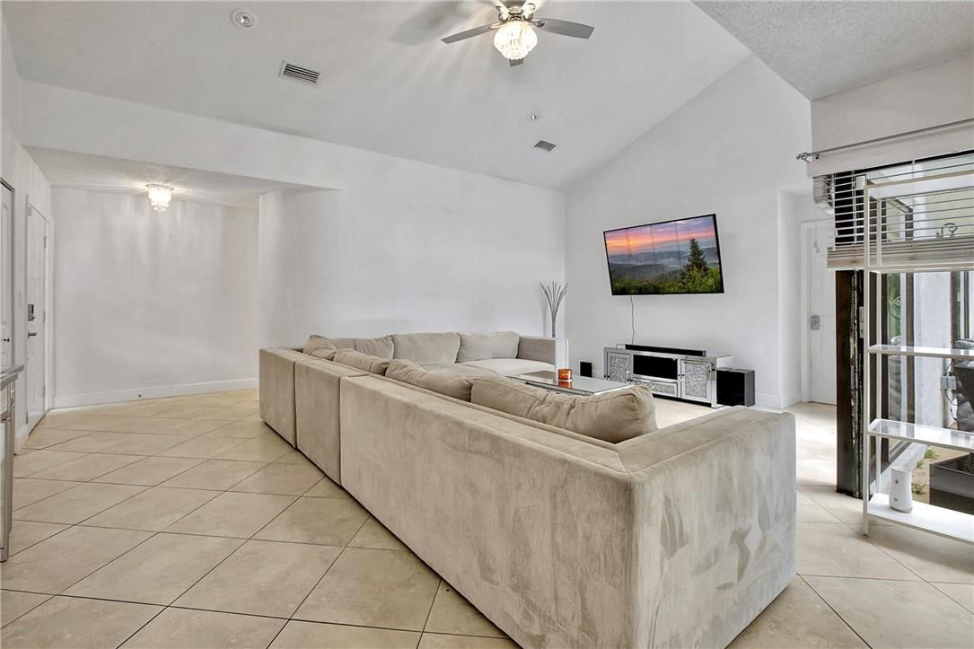 106 Kensington Road Hollywood, FL 33021 - Photo 11 of 42 a living room with furniture and a flat screen tv
