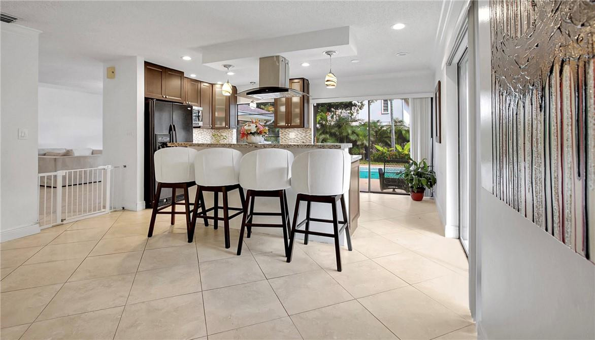 106 Kensington Road Hollywood, FL 33021 - Photo 15 of 42 a view of a dining room with furniture