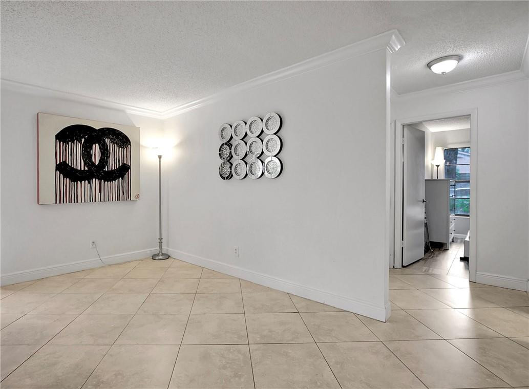 106 Kensington Road Hollywood, FL 33021 - Photo 20 of 42 a view of an empty room and wooden floor