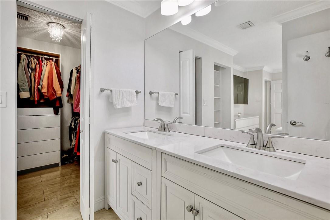 106 Kensington Road Hollywood, FL 33021 - Photo 26 of 42 a bathroom with a sink and a mirror