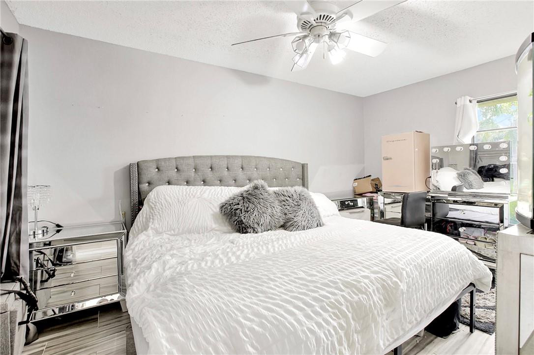106 Kensington Road Hollywood, FL 33021 - Photo 29 of 42 a bedroom with a bed and ceiling fan