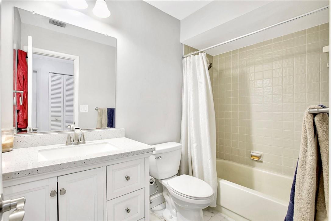 106 Kensington Road Hollywood, FL 33021 - Photo 31 of 42 a bathroom with a sink a toilet and shower