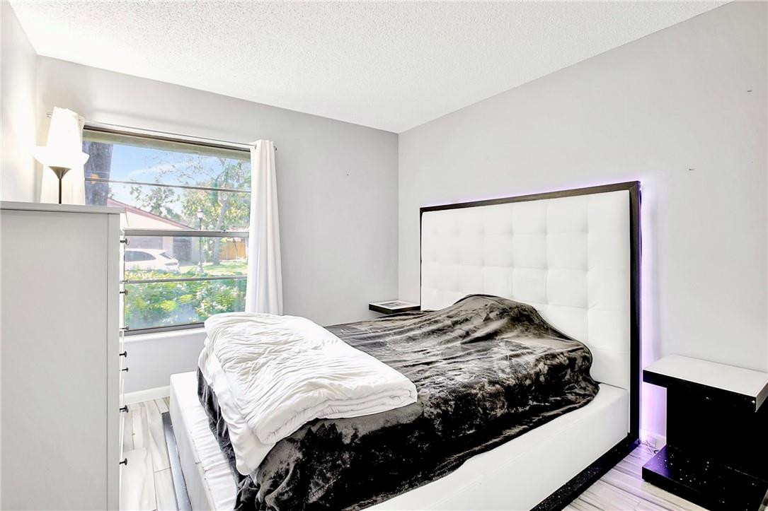 106 Kensington Road Hollywood, FL 33021 - Photo 33 of 42 a bedroom with a bed and a window