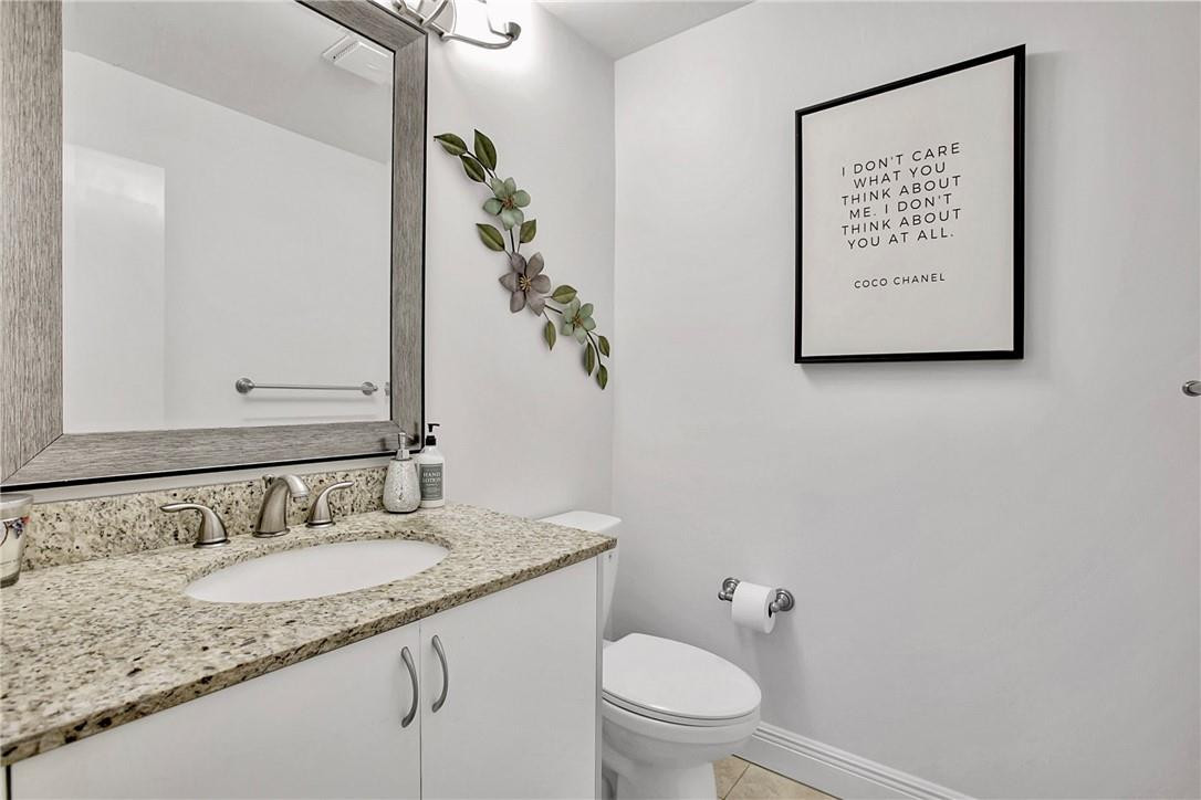 106 Kensington Road Hollywood, FL 33021 - Photo 34 of 42 a bathroom with a granite countertop sink and a mirror