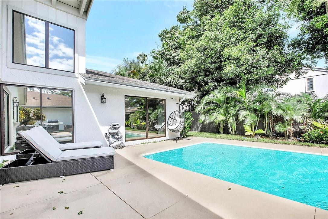 106 Kensington Road Hollywood, FL 33021 - Photo 35 of 42 a view of an house with backyard porch and entertaining space