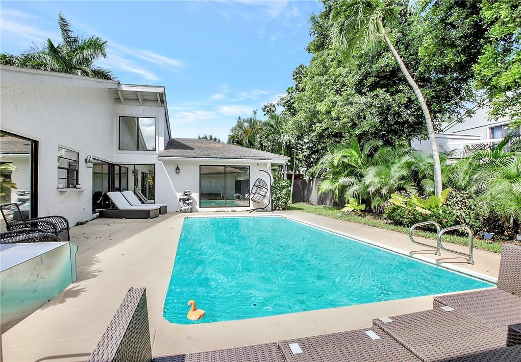 106 Kensington Road Hollywood, FL 33021 - Photo 36 of 42 a front view of a house with garden