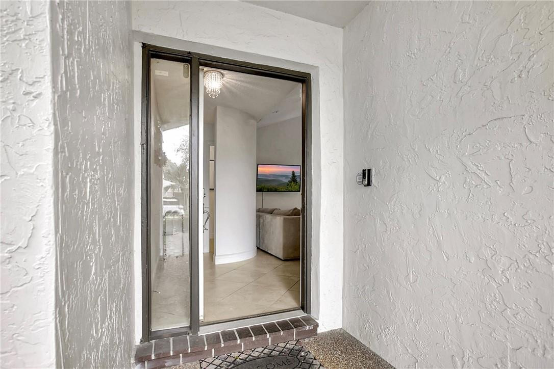 106 Kensington Road Hollywood, FL 33021 - Photo 7 of 42 a view of a bathroom from a hallway